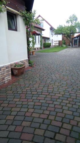 a brick driveway in front of a house at NEUSTADT Villa in Braşov