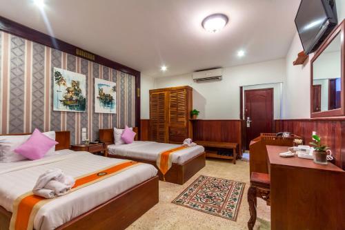 Postel nebo postele na pokoji v ubytování BayStone Resort