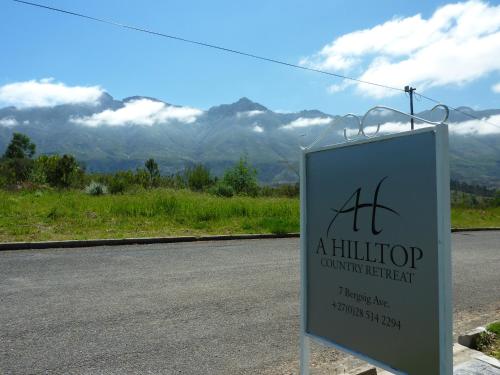 a sign on the side of a road at A Hilltop Country Retreat in Swellendam