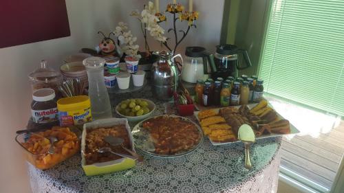 a table with many different types of food on it at L'Orso e L'Ape B&B in Giulianova