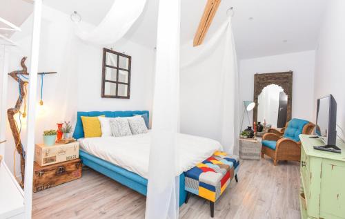 a bedroom with a bed and a desk at Parliament & River View Apartments in Bucharest