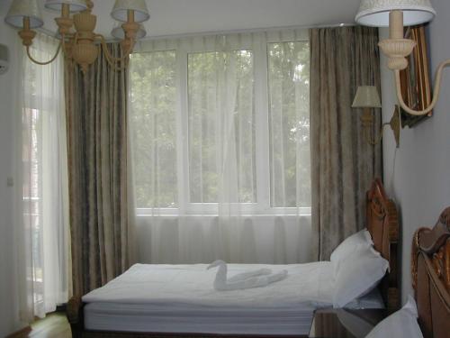 Легло или легла в стая в Oasis Suites Apartments and Studios