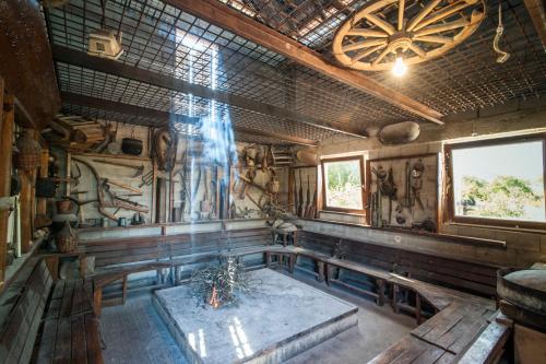 a room with a table in the center of a house at Holiday Home Poljičko Imanje in Donji Dolac