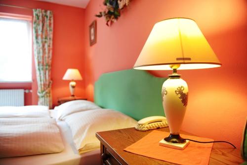 Кровать или кровати в номере Hotel Kienberger Hof