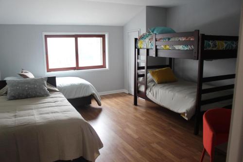 Двухъярусная кровать или двухъярусные кровати в номере Casa Mirabonita