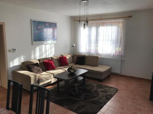 a living room with a couch and a table at Harrachov 571 in Harrachov