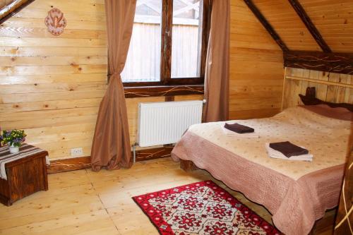 Ліжко або ліжка в номері Szlachta Cottage