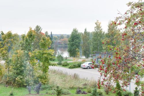 a car parked in a parking lot next to a lake at Sun Villa in Imatra