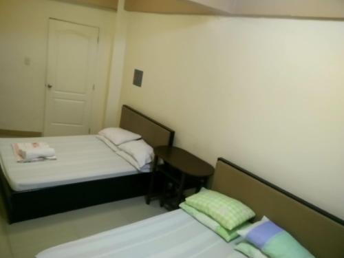 Cama o camas de una habitación en AAM Transient and Guest House