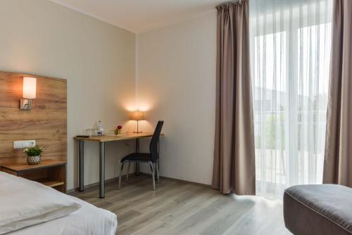 Ένα ή περισσότερα κρεβάτια σε δωμάτιο στο Maiers Hotel Parsberg