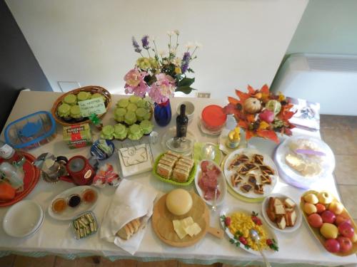 a table with a bunch of food on it at Agriturismo La Caputa in Urbania