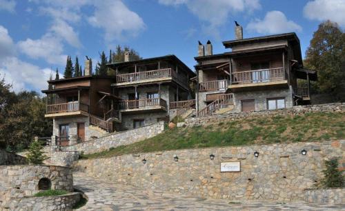 a group of buildings on top of a hill at Suites Efharis Filoxenon in Feneos