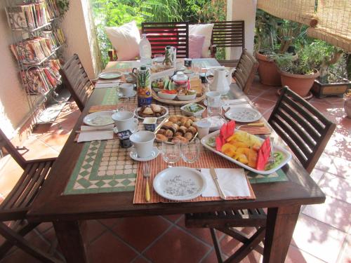 a wooden table with food on it on a patio at Sole e Sale B&B in San Cataldo