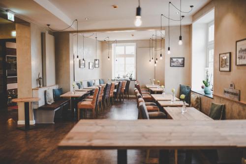 a row of tables and chairs in a restaurant at Altes Zollamt in Husum