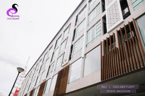 a building with windows on the side of it at Studio Exclusive (Kota Bharu City Point) in Kota Bharu