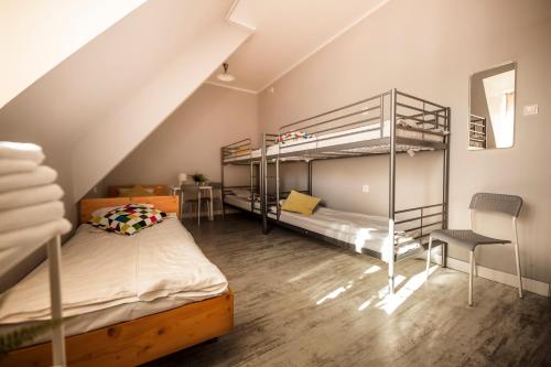 Кровать или кровати в номере Za Murami Hostel