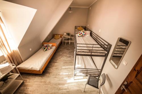Кровать или кровати в номере Za Murami Hostel