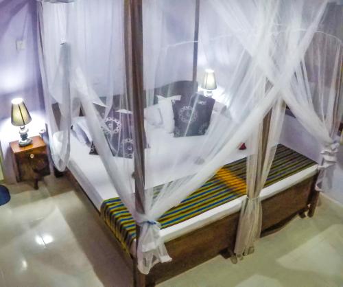 Una cama o camas en una habitación de Wijenayake's - Beach Haven Guest House - Galle Fort