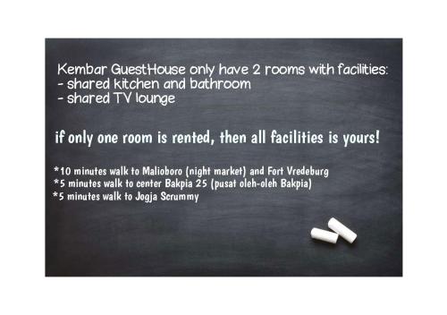 a page of a flyer with two white cigarettes at Kembar Guesthouse in Yogyakarta