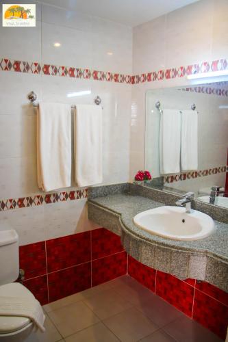 a bathroom with a sink and a toilet at Viva Sharm in Sharm El Sheikh