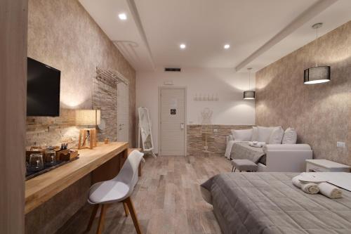 a bedroom with a bed and a living room at Veneto Suite Rome in Rome