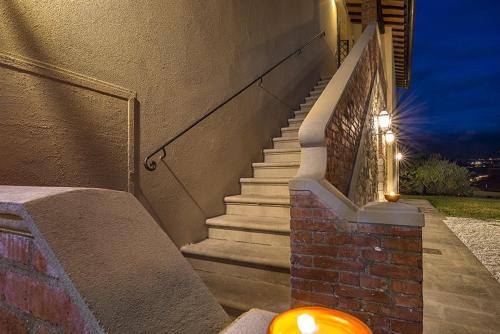 a set of stairs with a light next to a building at Sosta al Capitano in Pontassieve