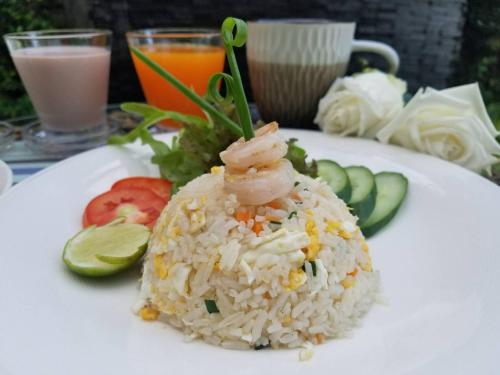 a plate of rice with shrimp on top of it at 9 SUITE Luxury Boutique Hotel in Chiang Mai