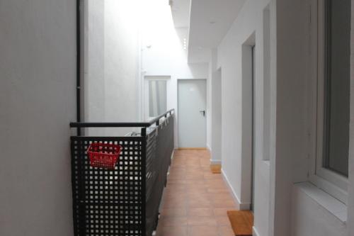 a hallway of a building with a basket on the wall at L'Hostalet d'Arenys de Mar in Arenys de Mar