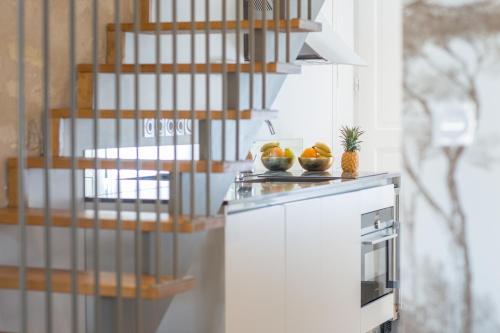 a kitchen with a counter with fruit on it at Villa Reale in Bordeaux