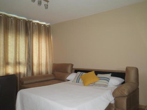 Apartamento Pleno Centro Marbella房間的床