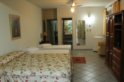Giường trong phòng chung tại Hotel Fazenda Bela Vista