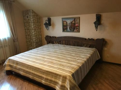 Кровать или кровати в номере Lobnya Village