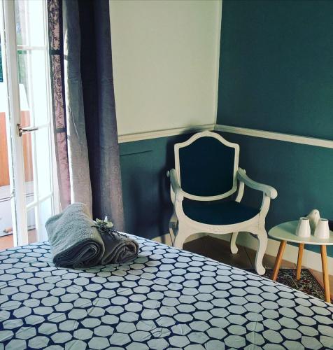 a bedroom with a bed and a chair at B&B Armonie in Ranica