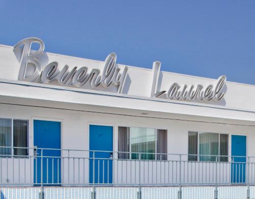 a building with a large sign on top of it at The Beverly Laurel Hotel at West Hollywood in Los Angeles
