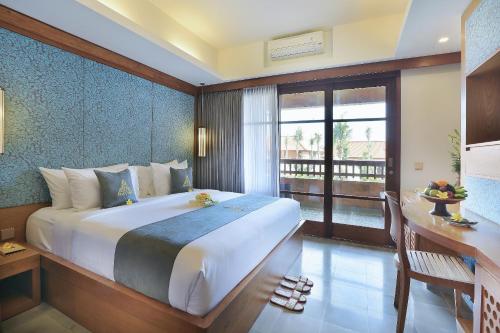 Una cama o camas en una habitación de The Alantara Sanur