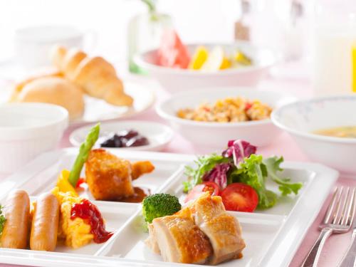 a white plate with different types of food on it at Chofu Creston Hotel in Chofu