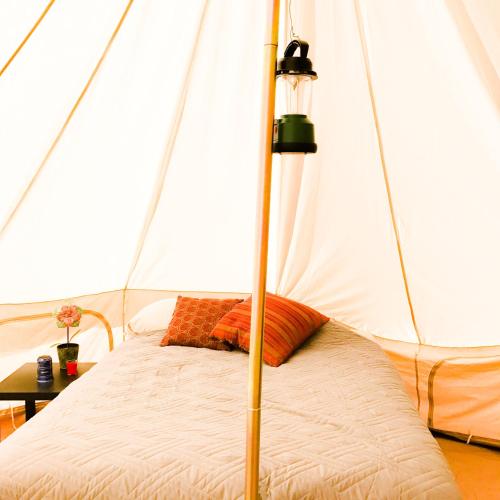 a bedroom with a bed in a tent at Zion View Camping in Hildale