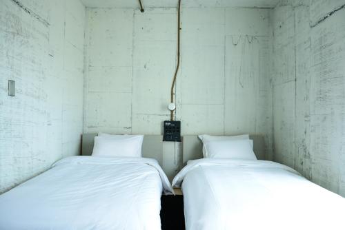 Postel nebo postele na pokoji v ubytování Rc Hotel Kyoto Yasaka