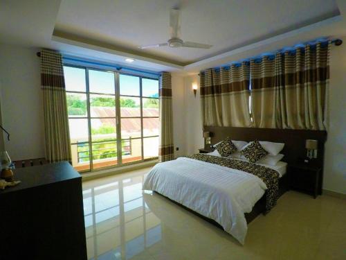 Кровать или кровати в номере Beach Home Kelaa