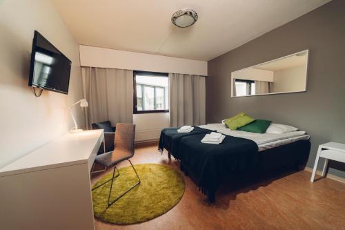 Postel nebo postele na pokoji v ubytování Hotel Kittilä
