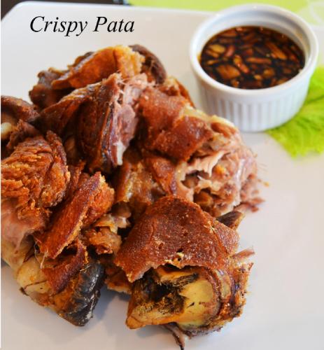 a plate of fried food with a dipping sauce at Hotel Monticello Tagaytay in Tagaytay