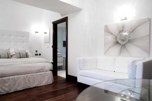 Katil atau katil-katil dalam bilik di Windermere Suites