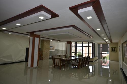 a dining room with a table and chairs at Hotel Veri in Peshkopi