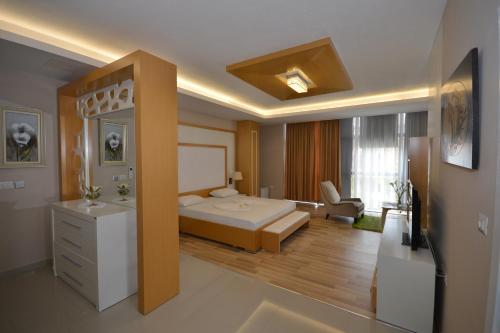 En eller flere senge i et værelse på Hotel Veri
