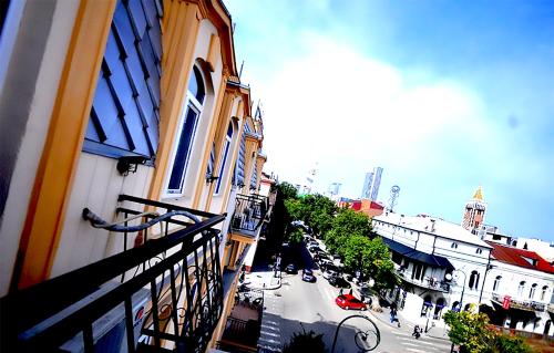 a view of a street from a balcony of a building at Black Sea Star Batumi in Batumi