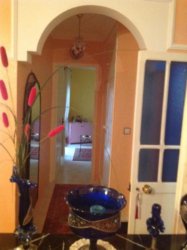 a bathroom with a blue bowl in a room at Chez Axia Marrakech in Marrakech