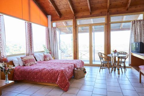 A bed or beds in a room at Vamos Palace Apartments
