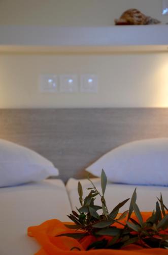 Postel nebo postele na pokoji v ubytování Galaxy Hotel