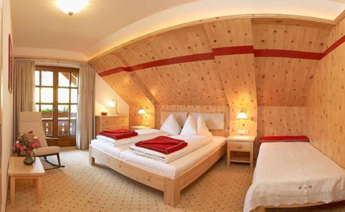 a bedroom with two beds in a room at Unterwirt in Bad Kleinkirchheim