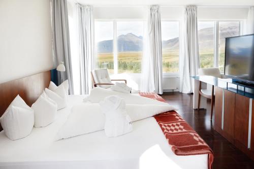 Ліжко або ліжка в номері Fosshótel Vatnajökull